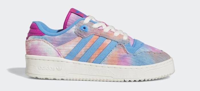 Side view of a pink and blue adidas shoe.